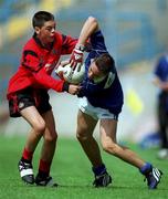 3 July 2000; James Keane of Tullamore holds off the challenge of Sean Parr of St. Bronagh's during the Feile Peil na nOg Boys U14 Football Division 2 Final match between Tullamore, Offaly v St. Bronagh's in Rostrevor, Down, at Croke Park in Dublin. Photo by Damien Eagers/Sportsfile