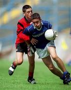 3 July 2000; James Keane of Tullamore is tackled by Sean Parr of St. Bronagh's during the Feile Peil na nOg Boys U14 Football Division 2 Final match between Tullamore, Offaly v St. Bronagh's in Rostrevor, Down, at Croke Park in Dublin. Photo by Damien Eagers/Sportsfile