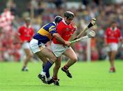 2 July 2000; Pat Ryan of Cork in action against John Leahy of Tipperary during the Guinness Munster Senior Hurling Championship Final between Cork and Tipperary at Semple Stadium in Thurles, Tipperary. Photo by Brendan Moran/Sportsfile