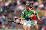 2 July 2000; Pat Tobin of Limerick in action against John O'Neill of Cork during the Munster Minor Hurling Championship Final between Cork and Limerick at Semple Stadium in Thurles, Tipperary. Photo by Ray McManus/Sportsfile