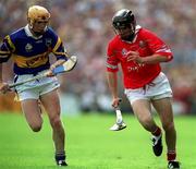 2 July 2000; Ben O'Connor of Cork in action against Paul Ormonde of Tipperary during the Guinness Munster Senior Hurling Championship Final between Cork and Tipperary at Semple Stadium in Thurles, Tipperary. Photo by Brendan Moran/Sportsfile