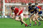 2 July 2000; Wayne Sherlock of Cork in action against Thomas Dunne of Tipperary during the Guinness Munster Senior Hurling Championship Final between Cork and Tipperary at Semple Stadium in Thurles, Tipperary. Photo by Ray McManus/Sportsfile