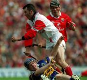 2 July 2000; Donal Og Cusack of Cork is tackled by Eugene O'Neill of  Tipperary during the Guinness Munster Senior Hurling Championship Final between Cork and Tipperary at Semple Stadium in Thurles, Tipperary. Photo by Ray McManus/Sportsfile