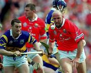 2 July 2000; Brian Corcoran of Cork in action against Liam Cahill of Tipperary during the Guinness Munster Senior Hurling Championship Final between Cork and Tipperary at Semple Stadium in Thurles, Tipperary. Photo by Ray McManus/Sportsfile