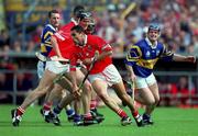 2 July 2000; Sean Og O'hAilpin of Cork in action against Eugene O'Neill of Tipperary during the Guinness Munster Senior Hurling Championship Final between Cork and Tipperary at Semple Stadium in Thurles, Tipperary. Photo by Ray McManus/Sportsfile