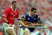 2 July 2000; John Carroll of Tipperary in action against Fergal McCormack of Cork during the Guinness Munster Senior Hurling Championship Final between Cork and Tipperary at Semple Stadium in Thurles, Tipperary. Photo by Ray McManus/Sportsfile