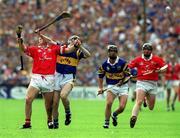 2 July 2000; Fergal McCormack of Cork in action against Michael Ryan of Tipperary during the Guinness Munster Senior Hurling Championship Final between Cork and Tipperary at Semple Stadium in Thurles, Tipperary. Photo by Brendan Moran/Sportsfile