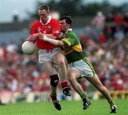 18 June 2000; Philip Clifford of Cork in action against Michael McCarthy of Kerry during the Bank of Ireland Munster Senior Football Championship Semi-Final match between Kerry and Cork at Fitzgerald Stadium in Killarney, Kerry. Photo by Damien Eagers/Sportsfile