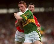 18 June 2000; Noel Kennelly of Kerry is tackled by Joe Kavanagh of Cork during the Bank of Ireland Munster Senior Football Championship Semi-Final match between Kerry and Cork at Fitzgerald Stadium in Killarney, Kerry. Photo by Damien Eagers/Sportsfile