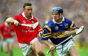 2 July 2000; Eugene O'Neill of Tipperary in action against Fergal Ryan of Cork during the Guinness Munster Senior Hurling Championship Final between Cork and Tipperary at Semple Stadium in Thurles, Tipperary. Photo by Brendan Moran/Sportsfile
