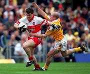 2 July 2000; Joe Brolly of Derry is tackled by Anto Finnegan of Antrim during the Bank of Ireland Ulster Senior Football Championship Semi-Final Replay between Antrim and Derry at Casement Park in Belfast, Antrim. Photo by Aoife Rice/Sportsfile