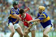 2 July 2000; Alan Browne of Cork is tackled by David Kennedy, left, and Paul Ormonde of Tipperary during the Guinness Munster Senior Hurling Championship Final between Cork and Tipperary at Semple Stadium in Thurles, Tipperary. Photo by Brendan Moran/Sportsfile