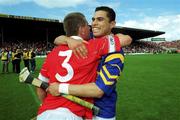 2 July 2000; Diarmuid O'Sullivan, left, and Sean Og O'hAilpin of Cork celebrate after the Guinness Munster Senior Hurling Championship Final between Cork and Tipperary at Semple Stadium in Thurles, Tipperary. Photo by Ray McManus/Sportsfile