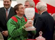 1 July 2000; Jockey Johnny Murtagh kisses the owners trophy after victory aboard Sinndar in the Budweiser Irish Derby at The Curragh Racecourse in Kildare. Photo by Damien Eagers/Sportsfile