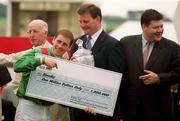 1 July 2000; Winning jockey Johnny Murtagh with a cheque for 1 million dollars after victory with Sinndar in the Budweiser Irish Derby at The Curragh Racecourse in Kildare. Photo by Damien Eagers/Sportsfile