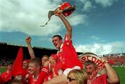 2 July 2000; Sean McGrath of Cork celebrates with fans after the Guinness Munster Senior Hurling Championship Final between Cork and Tipperary at Semple Stadium in Thurles, Tipperary. Photo by Ray McManus/Sportsfile