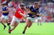 2 July 2000; Brian O'Meara of Tipperary in action against Wayne Sherlock of Cork during the Guinness Munster Senior Hurling Championship Final between Cork and Tipperary at Semple Stadium in Thurles, Tipperary. Photo by Brendan Moran/Sportsfile