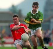 18 June 2000; Joe Kavanagh of Cork in action against Eamonn Fitzmaurice of Kerry during the Bank of Ireland Munster Senior Football Championship Semi-Final match between Kerry and Cork at Fitzgerald Stadium in Killarney, Kerry. Photo by Brendan Moran/Sportsfile