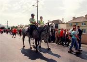 18 June 2000; Horse mounted Gardai mingle with supporters outside the stadoum prior  tothe Bank of Ireland Munster Senior Football Championship Semi-Final match between Kerry and Cork at Fitzgerald Stadium in Killarney, Kerry. Photo by Damien Eagers/Sportsfile