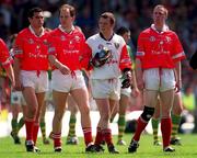 18 June 2000; Cork captain Philip Clifford, right, leads his team in the pre-match parade prior to the Bank of Ireland Munster Senior Football Championship Semi-Final match between Kerry and Cork at Fitzgerald Stadium in Killarney, Kerry. Photo by Brendan Moran/Sportsfile