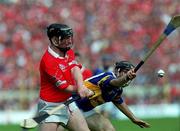 2 July 2000; Wayne Sherlock of Cork in action against Mark O'Leary of Tipperary during the Guinness Munster Senior Hurling Championship Final between Cork and Tipperary at Semple Stadium in Thurles, Tipperary. Photo by Ray McManus/Sportsfile