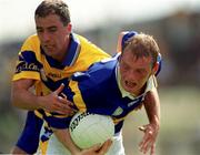 25 June 2000; Dan Hackett of Tipperary in action against Ger Keane of Clare during the Bank of Ireland Munster Senior Football Championship Semi-Final match between Clare and Tipperary at the Gaelic Grounds in Limerick. Photo by Brendan Moran/Sportsfile
