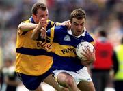 25 June 2000; Damien Byrne of Tipperary in action against Martin Daly of Clare during the Bank of Ireland Munster Senior Football Championship Semi-Final match between Clare and Tipperary at the Gaelic Grounds in Limerick. Photo by Brendan Moran/Sportsfile