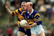 25 June 2000; Liam Cronin of Tipperary in action against Desi Mologhan Clare during the Bank of Ireland Munster Senior Football Championship Semi-Final match between Clare and Tipperary at the Gaelic Grounds in Limerick. Photo by Brendan Moran/Sportsfile