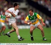 25 June 2000; Ken Doyle, Kildare, in action against Mel Keenaghan, Offaly. Offaly v Kildare, Leinster Senior Football Championship, Croke Park, Dublin. Picture credit; Ray McManus/SPORTSFILE
