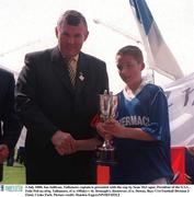 3 July 2000; Ian Sullivan, Tullamore captain is presented with the cup by Sean McCague, President of the GAA , Feile Peil na nOg, Tullamore, (Co. Offaly) v St. Bronagh's, Rostrevor, (Co. Down), Boys U14 Football Division 2 Final, Croke Park. Picture credit; Damien Eagers/SPORTSFILE