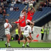 11 June 2000; Aidan O'Neill and Martin Farrelly, Louth, in action against Martin Lynch, (in mid air) Willie McCreery and Glenn Ryan (6), Kildare. Louth v Kildare, Leinster Football Championship, Croke Park, Dublin. Picture credit; Brendan Moran/SPORTSFILE