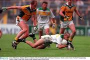 4 June 2000; Barry Malone, Offaly is tackled by John McDermott, (left) and Ronan Fitzsimons, Meath, Leinster Senior Football Championship, Meath v Offaly, Croke Park. Picture credit; Damien Eagers/SPORTSFILE