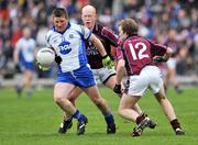20 April 2008; Rory Woods, Monaghan, in action against Donal O'Donoghue and Doran Haret, right, Westmeath. Allianz National Football League, Division 2, Round 7, Monaghan v Westmeath, St Tighearnach's Park, Clones, Co. Monaghan. Picture credit: Brian Lawless / SPORTSFILE *** Local Caption ***