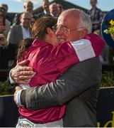 6 April 2015; Jockey Katie Walsh celebrates with her father and trainer Ted Walsh after her mount Thunder And Roses won the BoyleSports Irish Grand National Steeplechase. Fairyhouse Easter Festival, Fairyhouse, Co. Meath. Picture credit: Pat Murphy / SPORTSFILE
