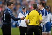 5 April 2015; Team captains Stephen Cluxton, left, Dublin, and Conor McManus, Monaghan, shake hands in the company of referee Maurice Deegan before the game. Allianz Football League, Division 1, Round 7, Monaghan v Dublin. St Tiernach’s Park, Clones, Co. Monaghan. Picture credit: Brendan Moran / SPORTSFILE