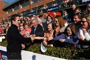 7 April 2015; Jockey Tony McCoy shakes the hands of racegoers in the winners enclosure. Fairyhouse Easter Festival, Fairyhouse, Co. Meath. Picture credit: Ramsey Cardy / SPORTSFILE