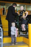 26 April 2008; James O'Connor, age 2, from Freshford, Co. Kilkenny, minds the cup as Kilkenny captain Marie O'Connor is interviewed after the match. Camogie National League Divison 1 Final, Galway v Kilkenny, Nowlan Park, Co. Kilkenny. Picture credit: Stephen McCarthy / SPORTSFILE  *** Local Caption ***