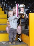 26 April 2008; Kilkenny captain Marie O'Connor lifts the cup with the aid of her nephew James O'Connor, age 2, from Freshford, Co. Kilkenny. Camogie National League Divison 1 Final, Galway v Kilkenny, Nowlan Park, Co. Kilkenny. Picture credit: Stephen McCarthy / SPORTSFILE  *** Local Caption ***
