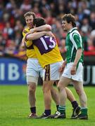 27 April 2008; Wexford's Paddy Colfer, left, celebrates with team-mate Ciaran Long after the match as Fermanagh's Peter Sherry looks on. Allianz National Football League, Division 3 Final, Wexford v Fermanagh, Parnell Park, Dublin. Picture credit: Brian Lawless / SPORTSFILE *** Local Caption ***