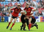 27 April 2008; Tomas O'Leary, Munster, is tackled by Adam Powell, left, and Kevin Sorrell, Saracens. Heineken Cup Semi-Final, Saracens v Munster, Ricoh Arena, Coventry, England. Picture credit: Stephen McCarthy / SPORTSFILE *** Local Caption ***     12 13