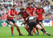 27 April 2008; Jerry Flannery, Munster, is tackled by Kristian Chesney, Saracens. Heineken Cup Semi-Final, Saracens v Munster, Ricoh Arena, Coventry, England. Picture credit: Stephen McCarthy / SPORTSFILE *** Local Caption ***