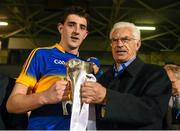 9 April 2015; John O'Connor, Chairman, EirGrid, presents the EirGrid Munster U21 Football Championship trophy to Tipperary captain Colin O'Riordan following their EirGrid Munster U21 Football Championship Final victory at Semple Stadium, Thurles, Co. Tipperary. Picture credit: Stephen McCarthy / SPORTSFILE
