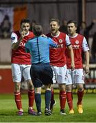 10 April 2015; St Patrick's Athletic players Killian Brennan, left, and Ger O'Brien remonstrate with referee Derek Tomney after their team-mate Lee Desmond was shown a red card. SSE Airtricity League, Premier Division, St Patrick's Athletic v Cork City. Richmond Park, Dublin. Picture credit: David Maher / SPORTSFILE