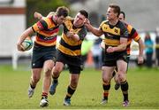 11 April 2015; Foster Horan, Lansdowne, is tackled by Hugh McGrath and Diarmuid McCarthy, right, Young Munster. Ulster Bank League, Division 1A, Young Munster v Lansdowne. Tom Clifford Park, Limerick. Picture credit: Diarmuid Greene / SPORTSFILE