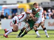 11 April 2015; Aly Muldowney, Connacht, is tackled by Callum Black, left, and Chris Henry, Ulster. Guinness PRO12, Round 19, Connacht v Ulster, Sportsground, Galway. Picture credit: Ramsey Cardy / SPORTSFILE