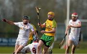 11 April 2015; Christopher McDermott, Donegal, in action against Chris Cross, Justin Kelly and Conor Casey, Tyrone. Allianz Hurling League Division 2B Promotion / Relegation Play-off, Donegal v Tyrone, Owenbeg, Derry. Picture credit: Oliver McVeigh / SPORTSFILE