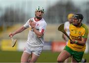 11 April 2015; Gerard Gilmore, Tyrone, in action against Jamsie Donnelly, Donegal. Allianz Hurling League Division 2B Promotion / Relegation Play-off, Donegal v Tyrone, Owenbeg, Derry. Picture credit: Oliver McVeigh / SPORTSFILE