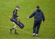 11 April 2015; The Kerry goalkeeper coach and former Tipperary All Star goalkeeper Brendan Cummins runs in to assistStephen Murphy as he makes his way to the dressing room at half time.  Allianz Hurling League Division 1B Promotion / Relegation Play-off, Antrim v Kerry, Parnell Park, Dublin. Picture credit: Ray McManus / SPORTSFILE