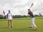 28 April 2008; Galway hurler Greg Kennedy shows his skills to Waterford hurler Dave Bennett at the launch of the FBD GAA Golf Challenge. Carton House, Maynooth, Co. Kildare. Picture credit: David Maher / SPORTSFILE
