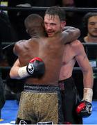 11 April 2015; Andy Lee (black and red gloves) embraces Peter Quillin after their middleweight fight. Barclays Center, Brooklyn, New York, USA. Picture credit: Tim Hunger / SPORTSFILE World Boxing Organization